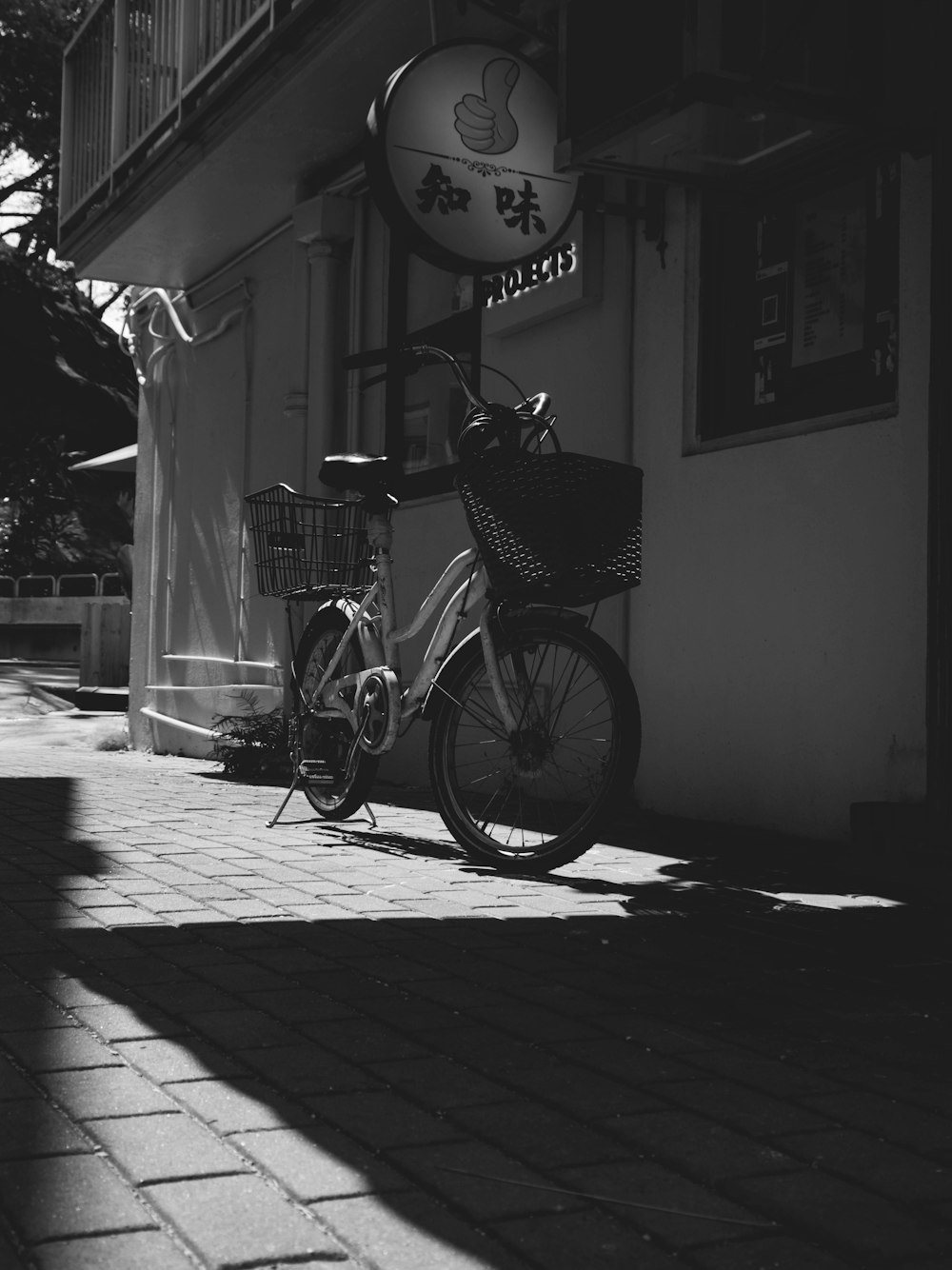 a bicycle parked on the side of a building