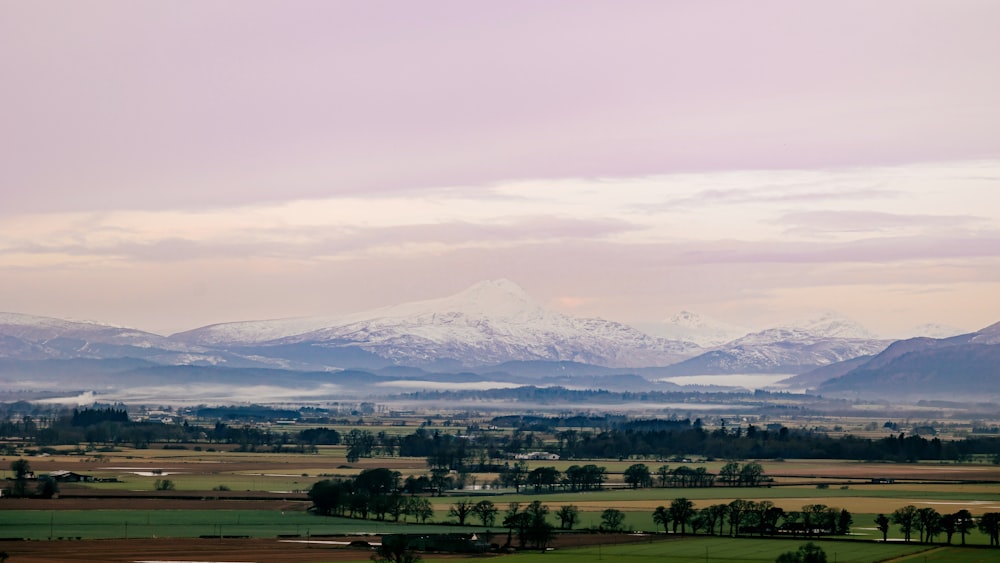 a view of a mountain range with snow on the mountains