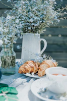Sunlit breakfast nook with fresh flowers and homemade pastries