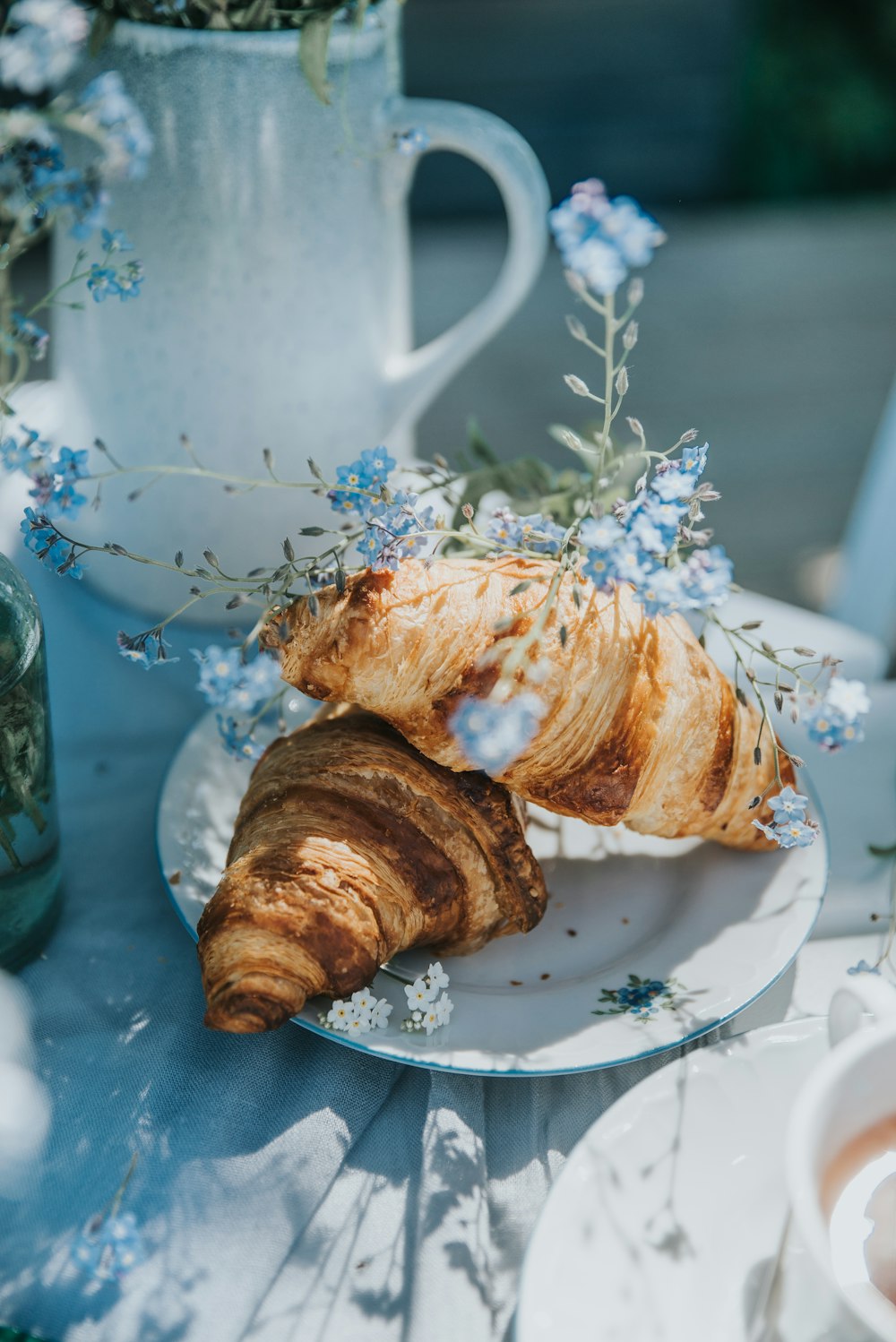 two croissants on a plate on a table