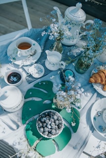 A beautifully arranged table with various teas and snacks.