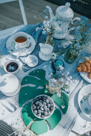 A beautifully arranged table with various teas and snacks.