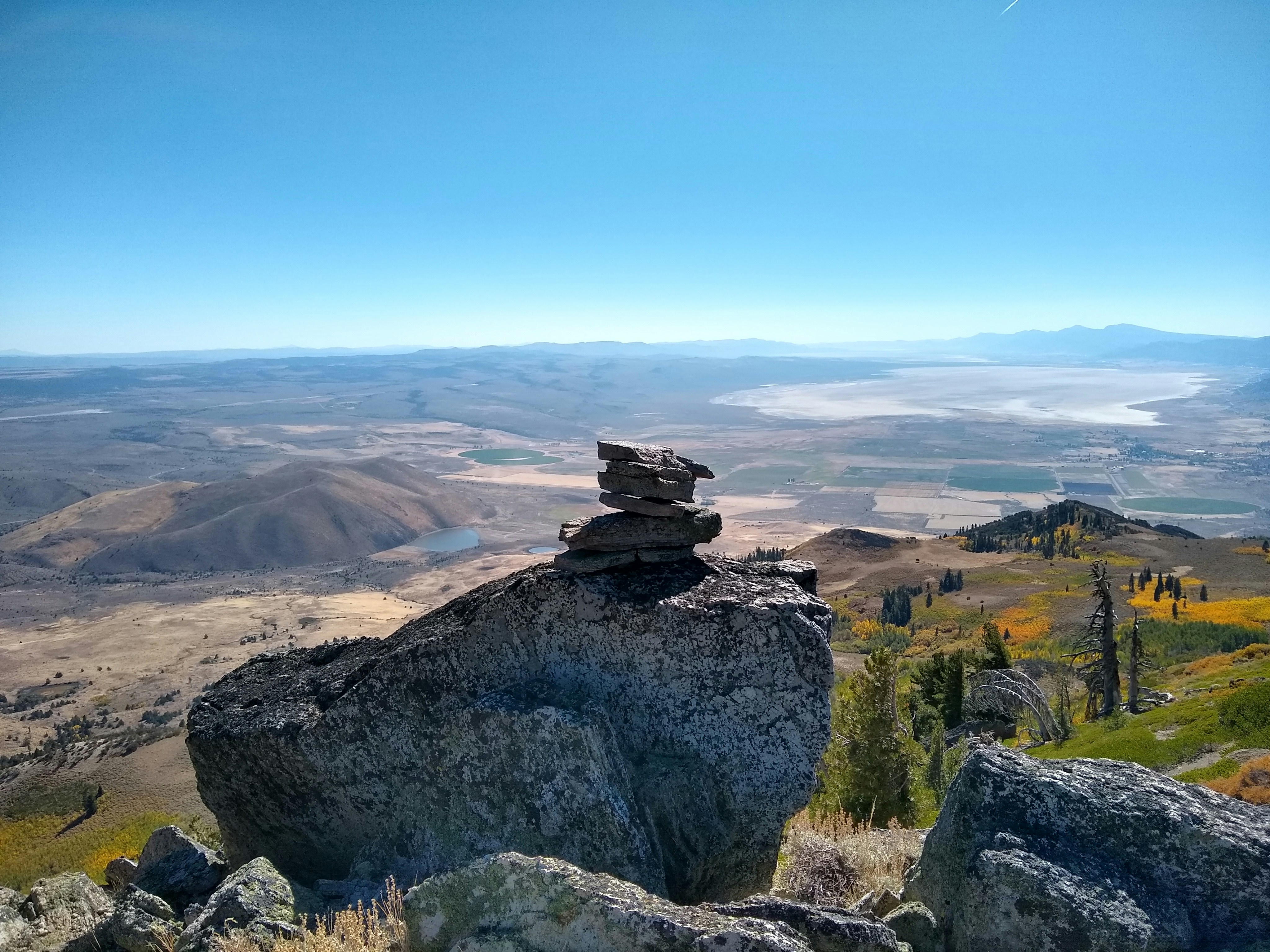 A pile of rocks sitting on top of a mountain photo – Free Bridge Image ...