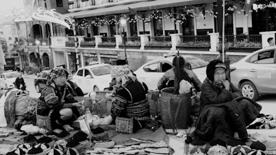A group of women proudly displaying handmade crafts at a local fair.