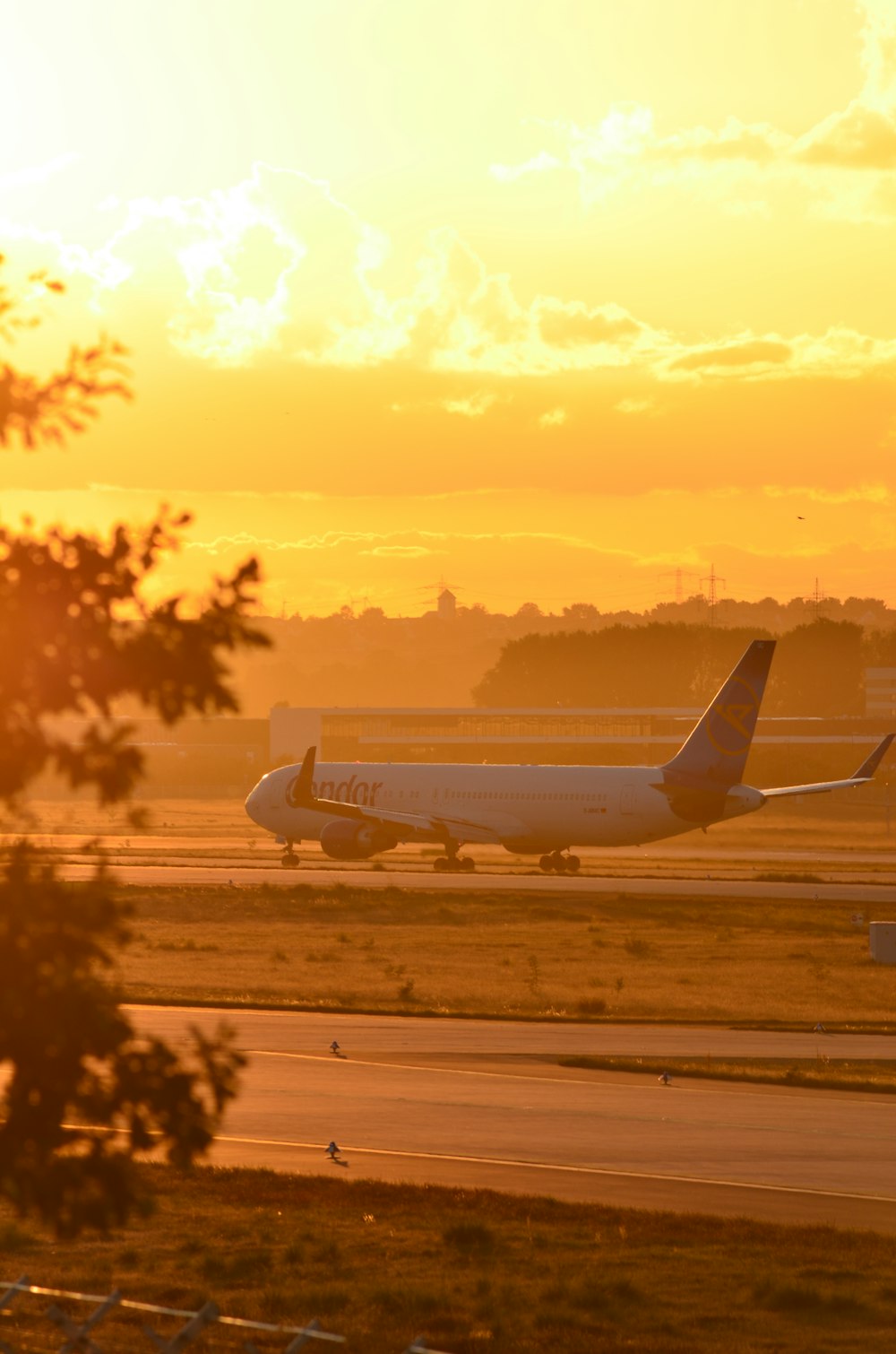 a large jetliner sitting on top of an airport runway