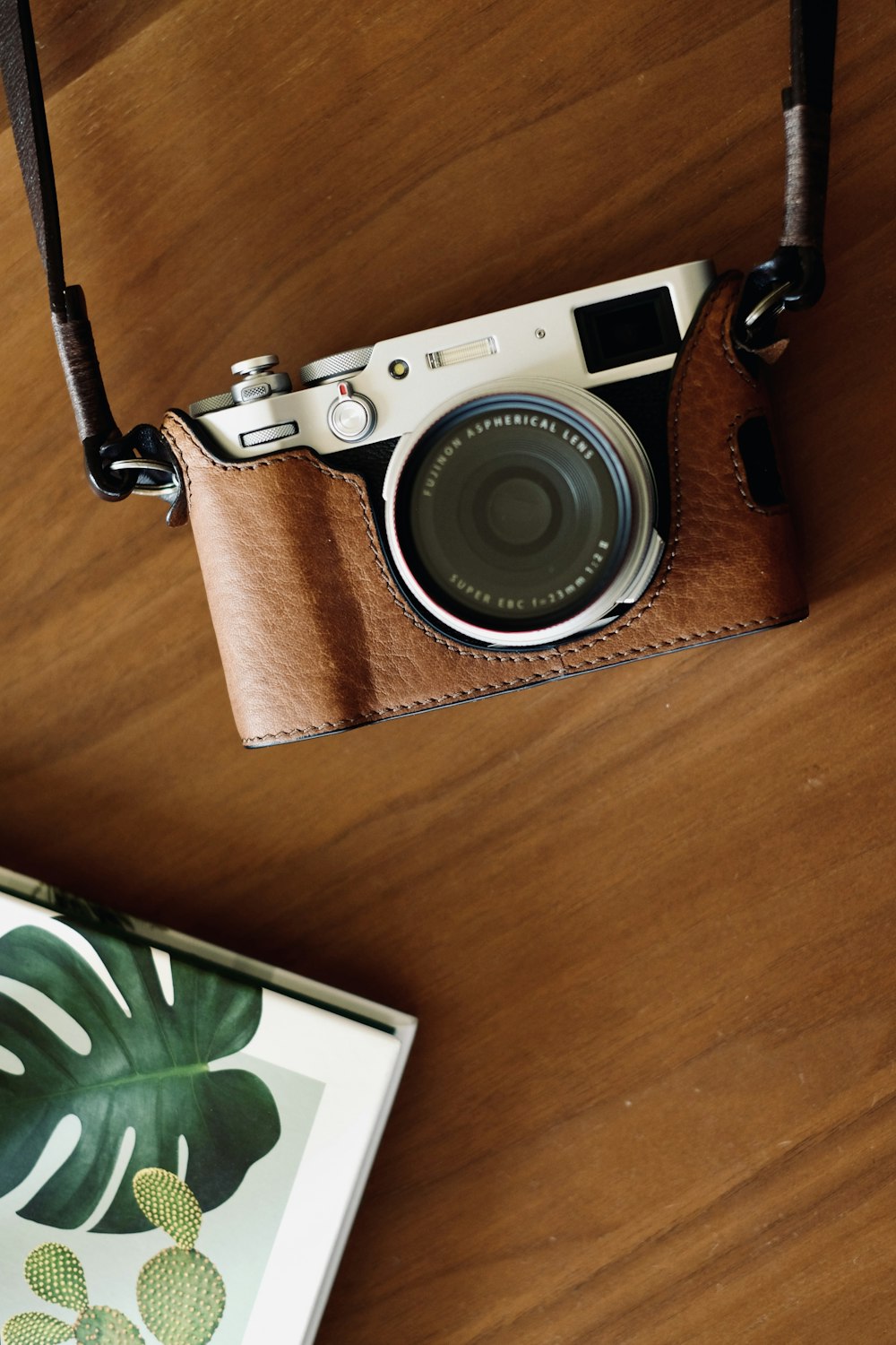 a camera sitting on top of a wooden table