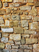 Close-up photo of stone masonry detailing on a garden wall.