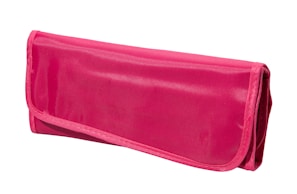 A close-up of a shimmering pink bling wallet with crystal accents on a soft velvet background