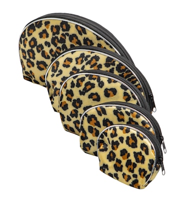 A set of small pouches with playful prints arranged on a cozy fabric background.