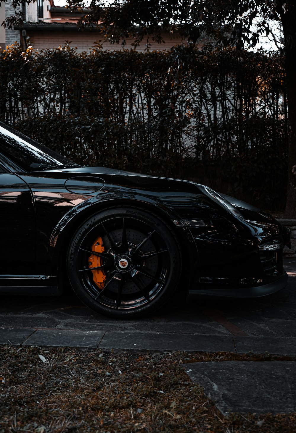 a black sports car parked on the side of the road