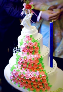 Elegant multi-tiered wedding cake decorated with delicate sugar flowers.