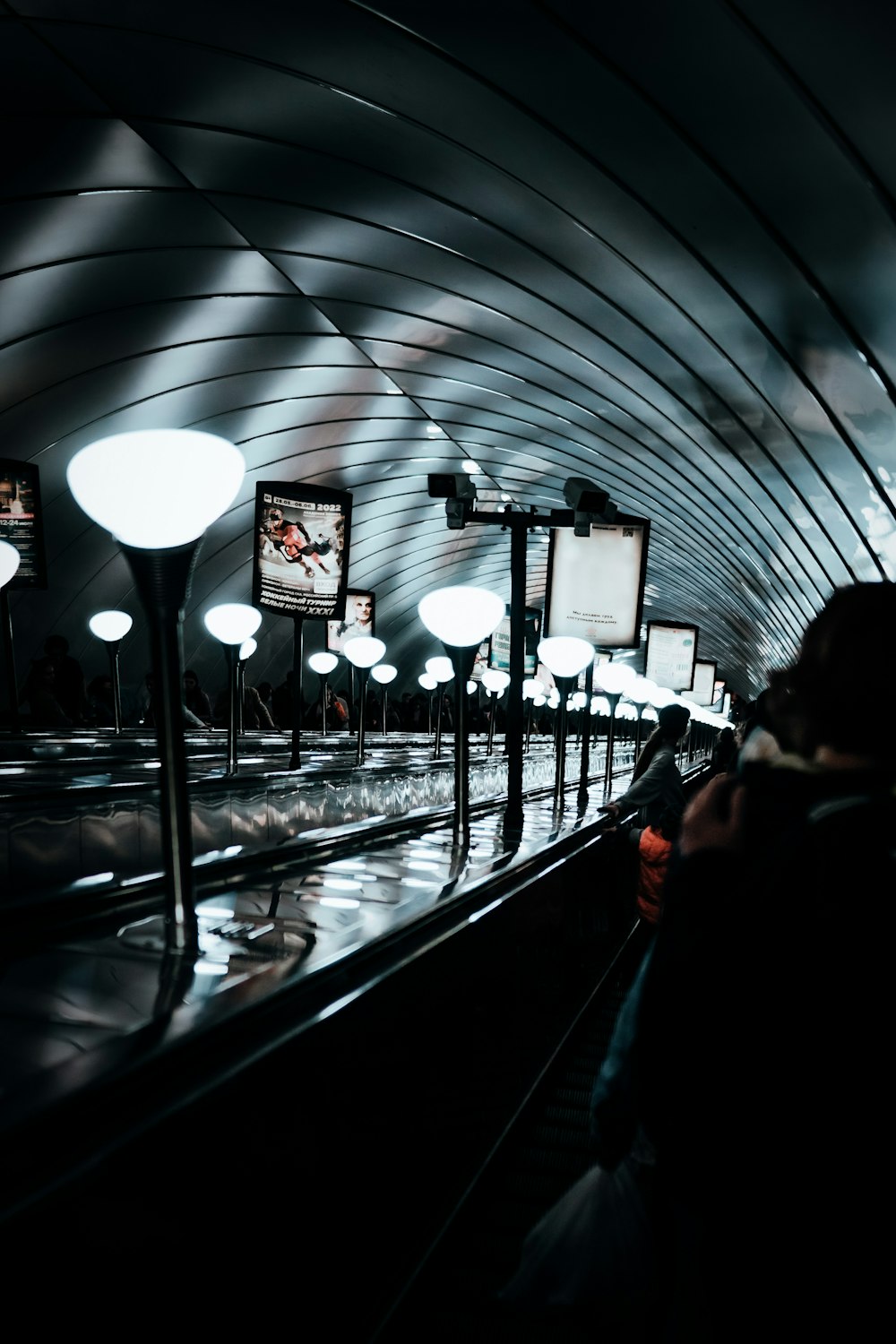 a subway station with people waiting for the train