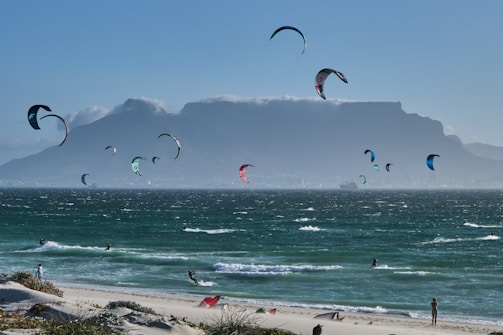 A panoramic view of a popular Chilean windsurf spot with mountains in the background.