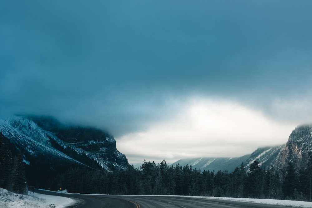 a road with a mountain in the background