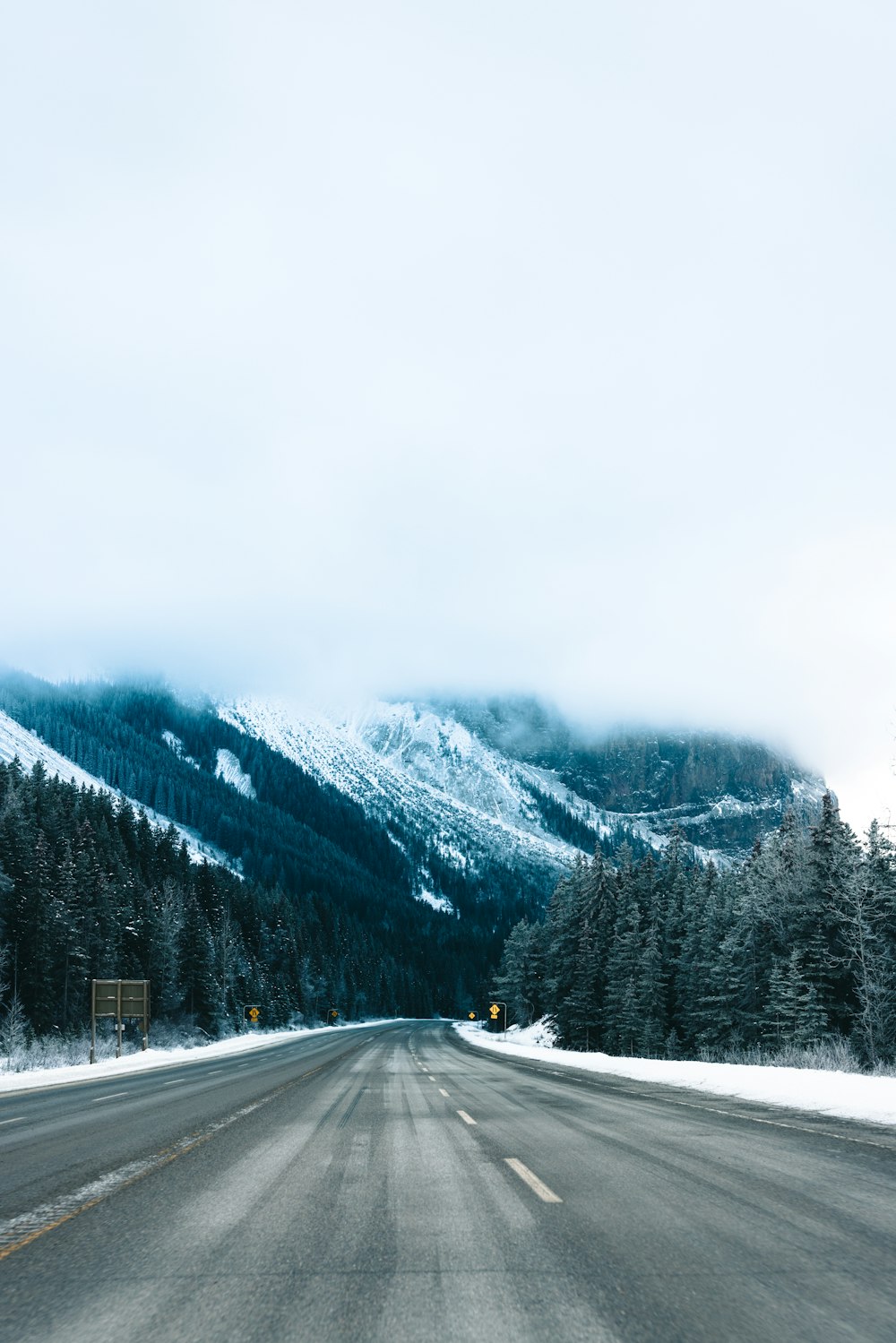 a road with a mountain in the background