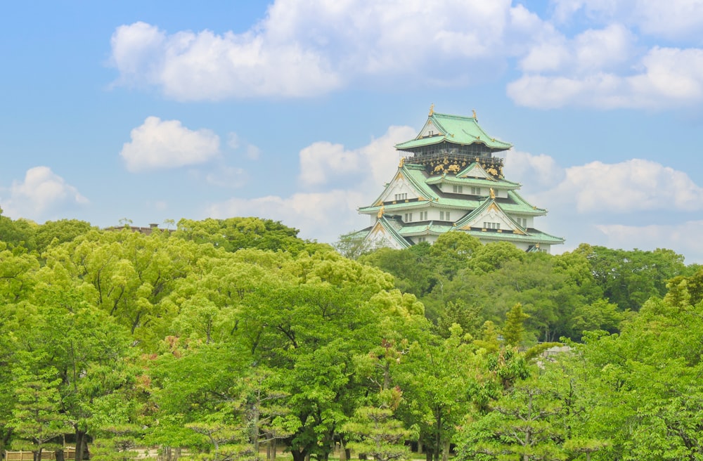 a tall tower sitting above a lush green forest