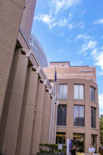 Professional office building of Pillar and Path Consulting in Islamabad with Pakistani flags and modern design.