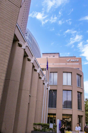 Professional office building of Pillar and Path Consulting in Islamabad with Pakistani flags and modern design.