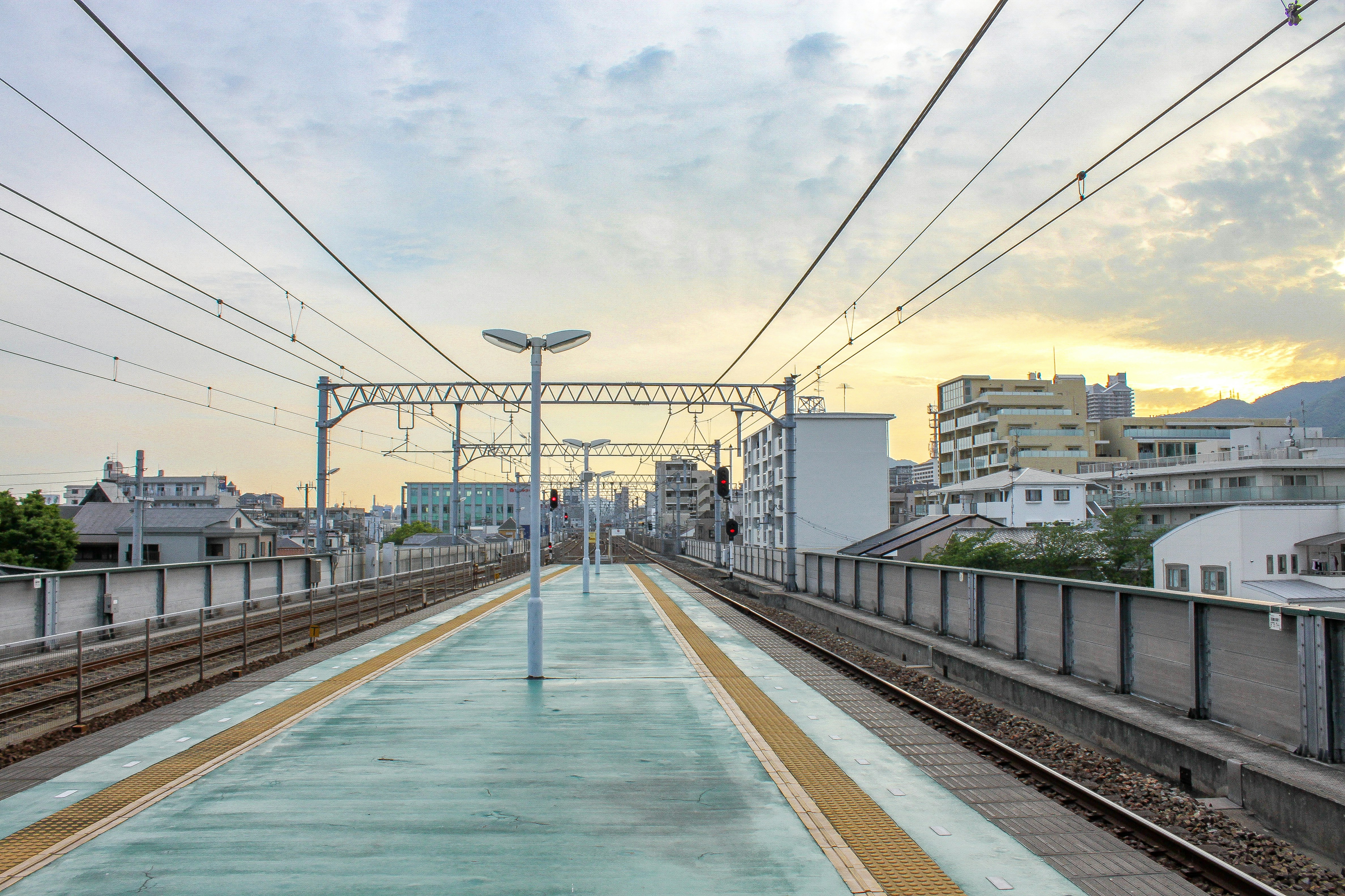 a train station with a train on the tracks