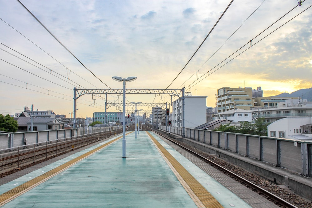 a train station with a train on the tracks