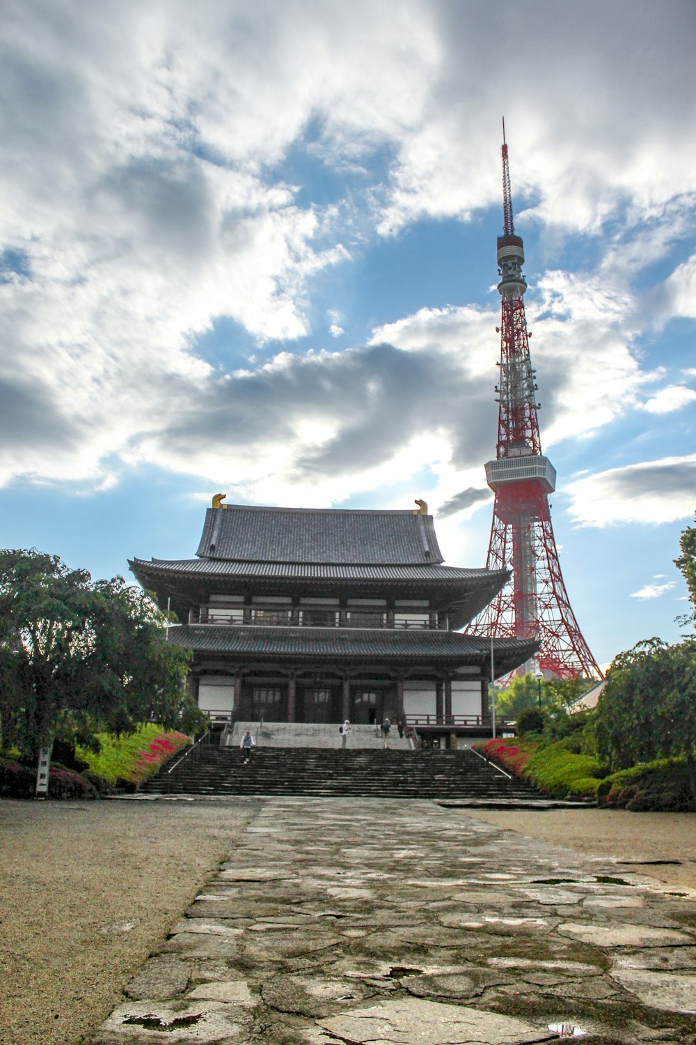 a very tall building with a tower in the background