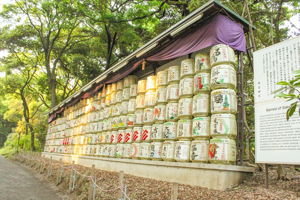 a wall covered in jars of various kinds of liquid