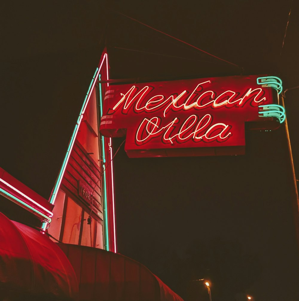 a red neon sign that reads mexican villa