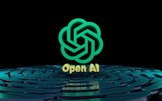 A stylized, green geometric logo resembling overlapping lines forms the central focus. Below the logo, the text 'Open AI' is displayed in a golden hue. The background features a pattern of concentric, reflective circles with a teal tint on a dark surface.
