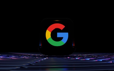 a close up of a computer keyboard with the google logo on it