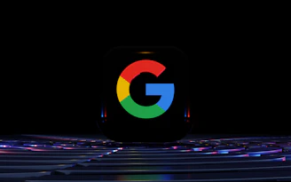 a close up of a computer keyboard with the google logo on it