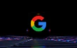 a close up of a computer keyboard with the google logo on it