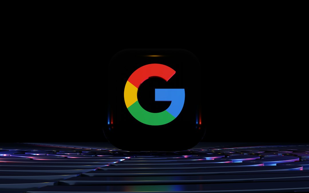 a close up of a computer keyboard with the google logo on it