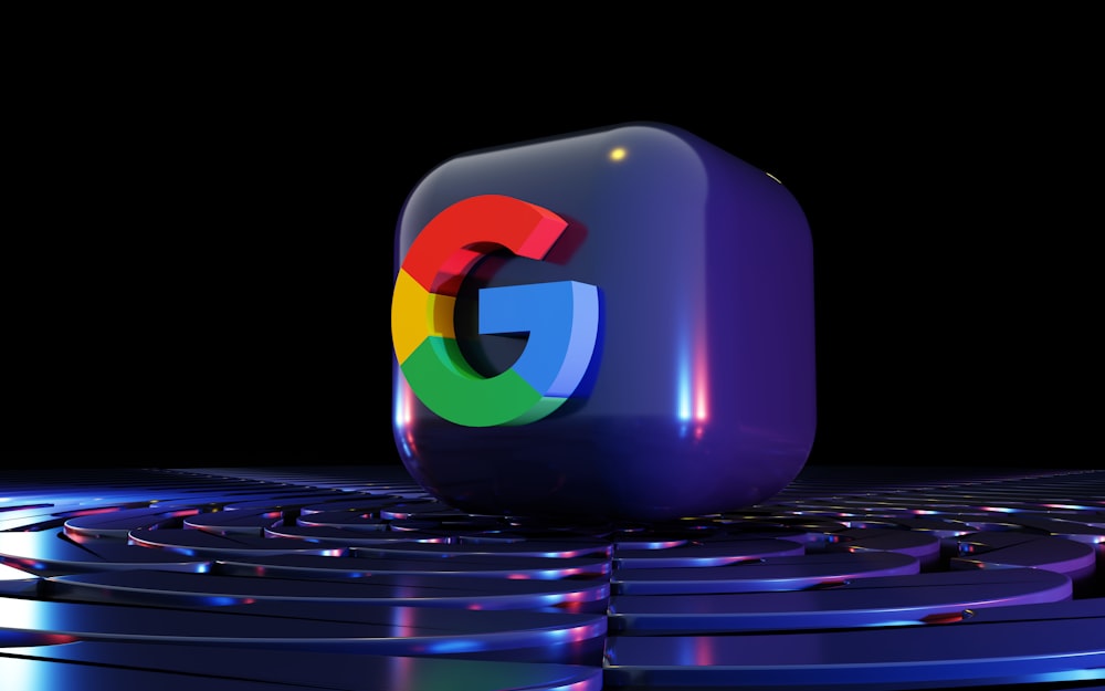 a google logo sitting on top of a computer keyboard
