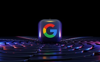 a google logo sitting on top of a computer keyboard