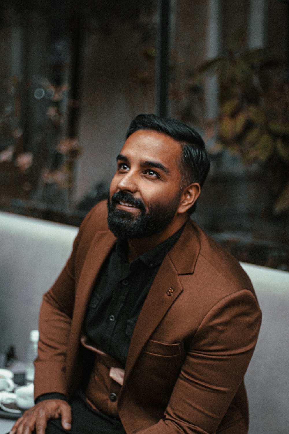 a man sitting at a table in a restaurant