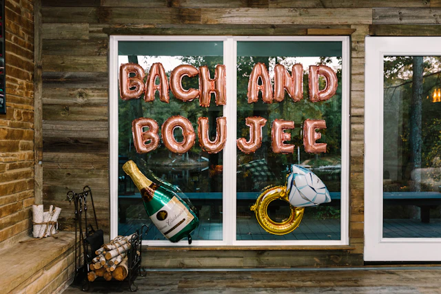 a sign that says bach and boulee in front of a window