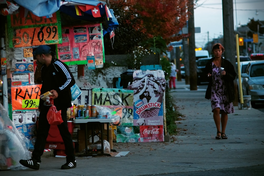 a couple of people walking down a street