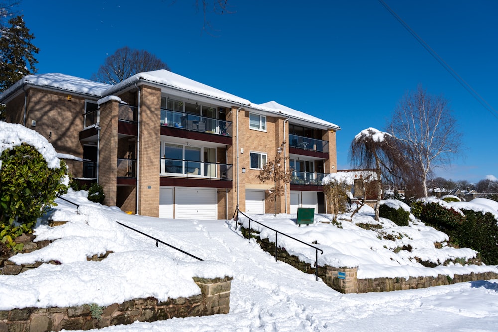 a house with a lot of snow on the ground