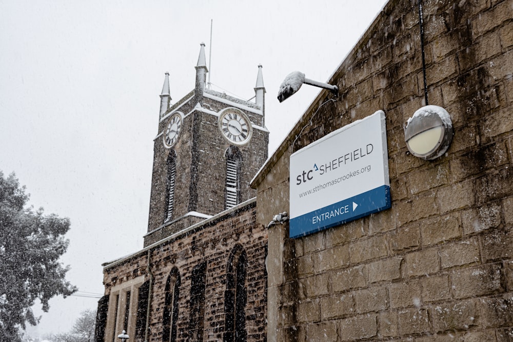 a church with a clock tower in the background