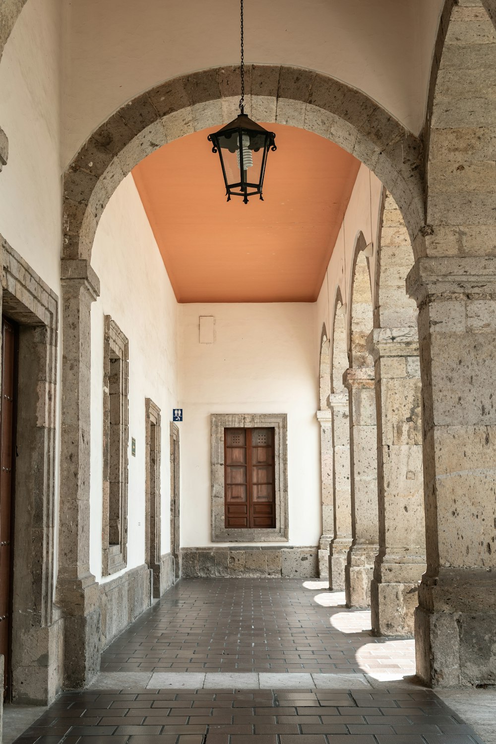 a hallway with a light hanging from the ceiling