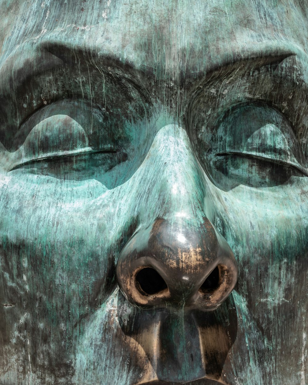 a close up of a statue of a person's face