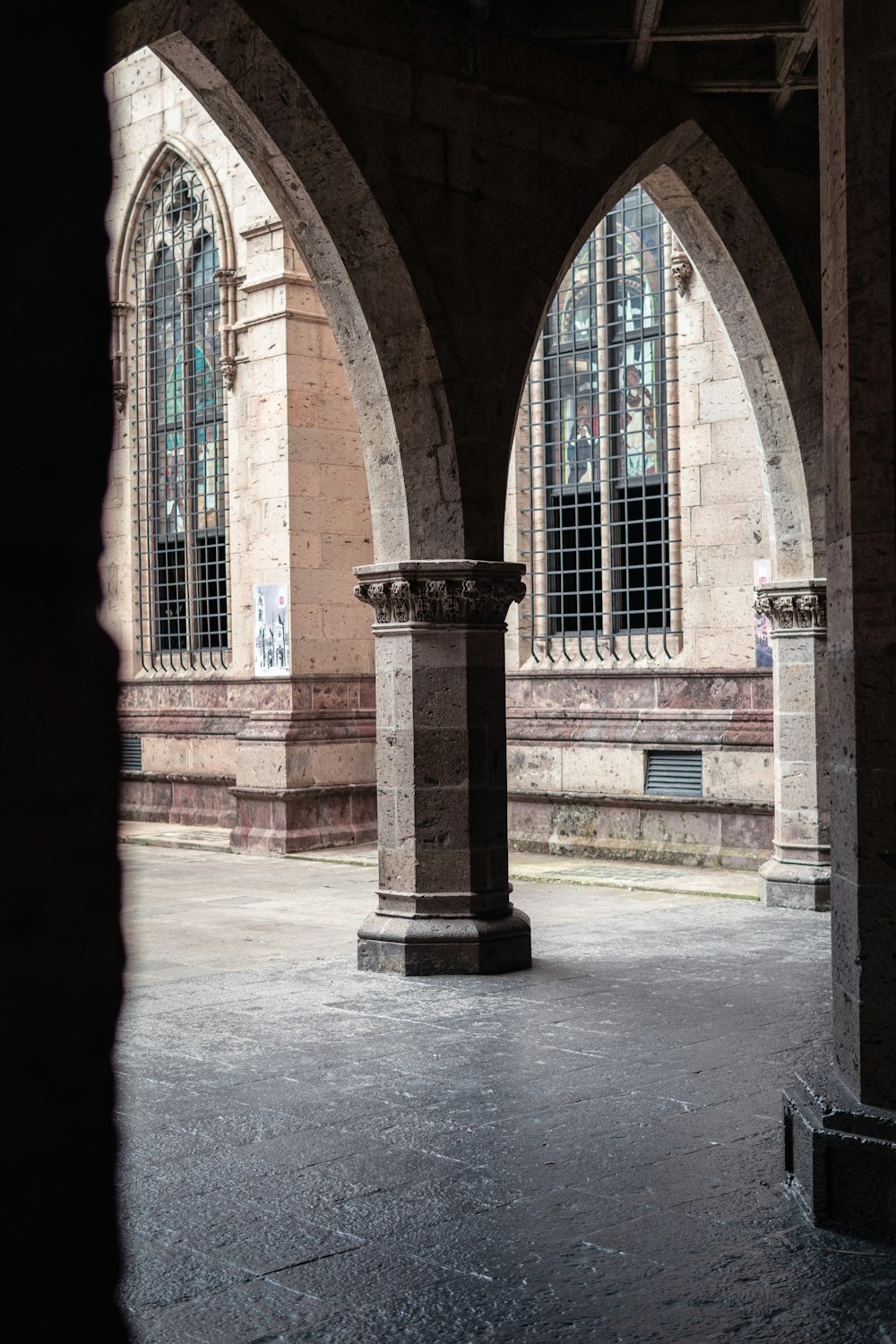 a couple of pillars in front of a building