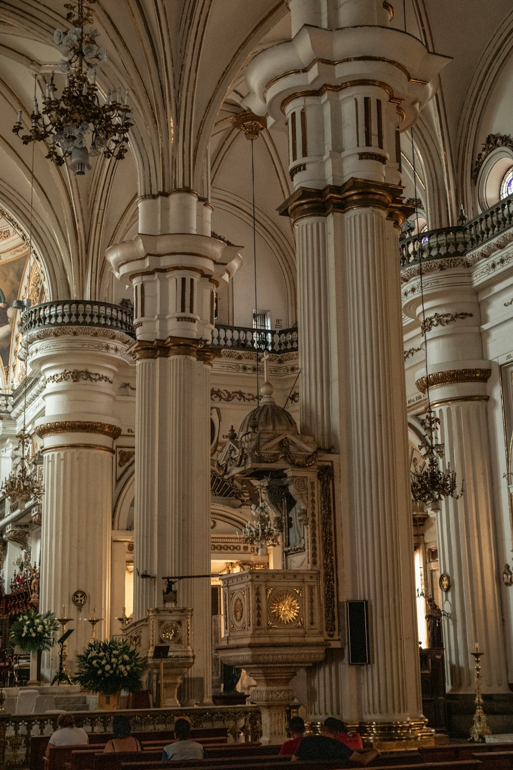 a church with a lot of pillars and a clock