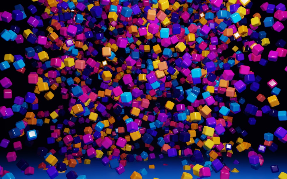 a group of colorful cubes floating in the air