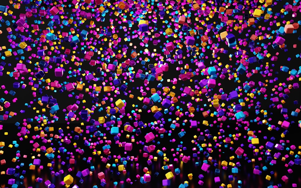 a large group of colorful objects floating in the air