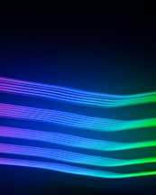 a black background with a multicolored wave of light