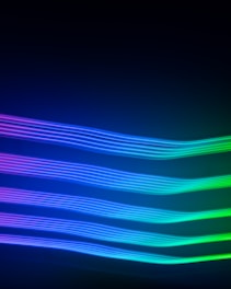a black background with a multicolored wave of light