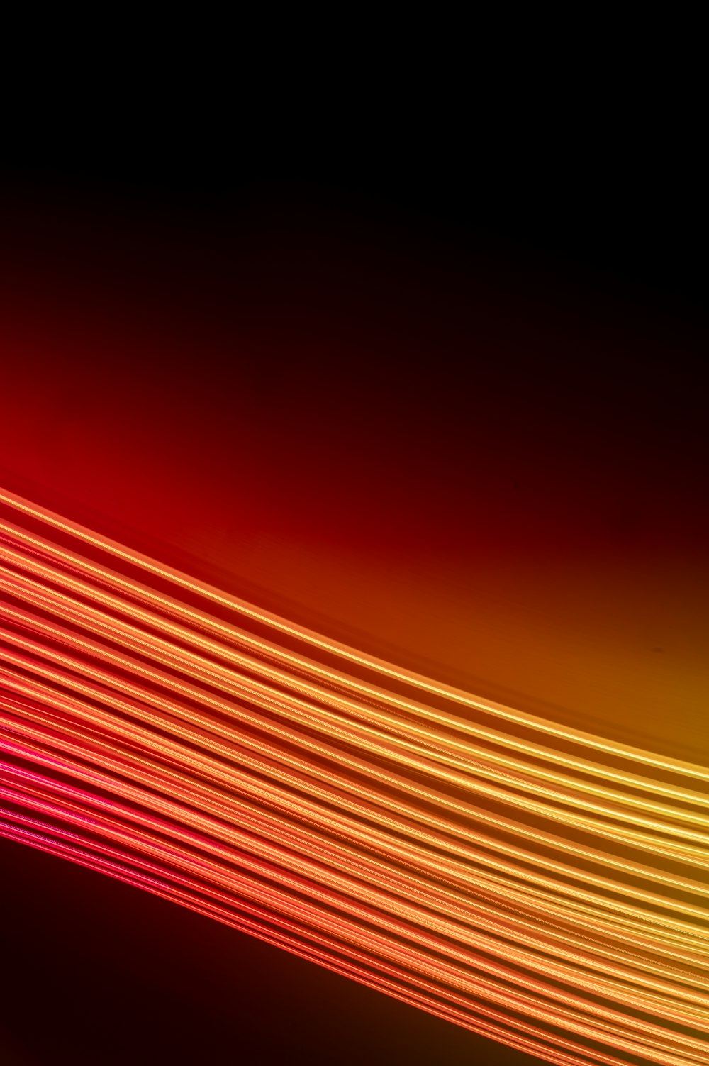 a red and yellow background with lines of light