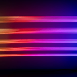 Horizontal neon lights in shades of purple, pink, and red create a vivid and futuristic visual effect against a dark background.