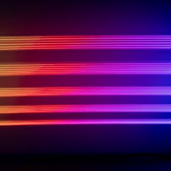 A futuristic interface with animated holographic elements in vibrant purple and red tones.